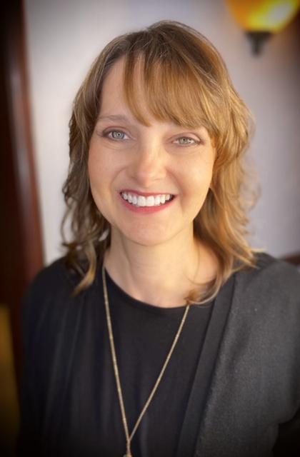 Dinah, a dental hygienist helping patients in need of dental implants.