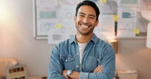 A young man smiling without worrying about gum disease.